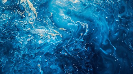 A striking blue abstract fluid pattern highlighted with lighter tones, reminiscent of liquid motion...