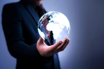 double exposure businessmen and simulation of globe on hand 