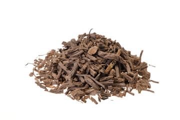 Pile of dried valerian root (Radix valerianae). Close-up, front view, isolated on a white background