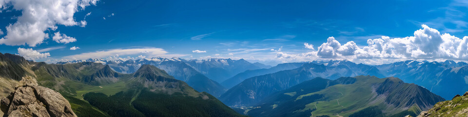 Wide panoramic photo of the mountains against the blue sky