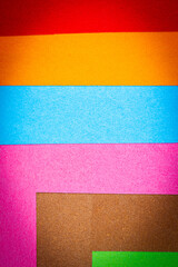 Fototapeta premium Multicolor background from a paper of different colors. Abstract colorful vibrant paper textures.
