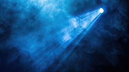 A focused beam of blue light illuminating through a cloud of smoke on a dark backdrop, emulating a theatrical stage effect.