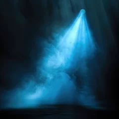 Ingelijste posters A vivid blue spotlight piercing through a haze of smoke on a black background, casting a mystical and captivating ambiance.  © Radetdararith