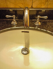 Bathroom sink. Toilet taps, water taps and WC basins. Public toilet interior design, home or hotel.
