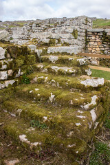 Old moss covered steps at Housesteads fort, a ruin of a roman fort along Hadrians Wall in Northern England