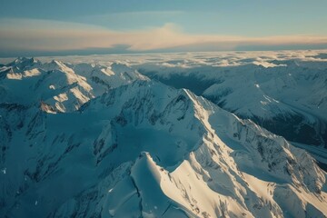 Obraz premium Aerial view of a snow-capped mountain range, glaciers carving paths, deep shadows emphasizing the peaks