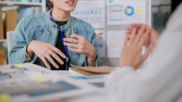 casual good vibe smile laugh conversation brainstorm ideas sharing marketing analysis stretegy talk moment discussion casual cloth Small group of business people working together at the office