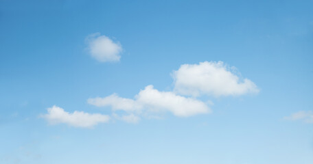 light blue sky panorama with some tiny fluffy clouds