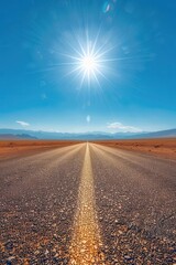 Fototapeta premium Empty road in desert, asphalt path, distant horizon, lowangle shot, warm sunlight, clear blue sky