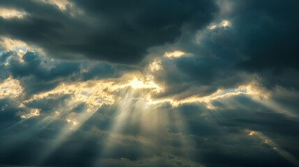 Silver Lining Emerges: Dramatic Sunrays Piercing Through Dark Storm Clouds in a Striking Contrast of Light and Shadow