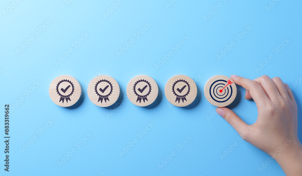 Poster standard quality control and certification concept. hand places wooden block with target icon among 