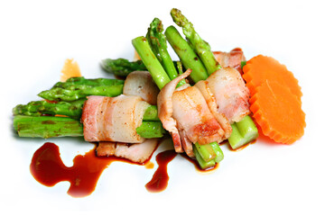 Grilled green asparagus wrapped with bacon in white background 