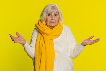 What. Why. Angry senior old woman raising hands in indignant expression, asking reason of failure...