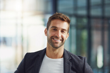 Business man, portrait and happy in office for company, trust and about us with smile as expert. Financial advisor, face and professional person at workplace for growth with experience or knowledge