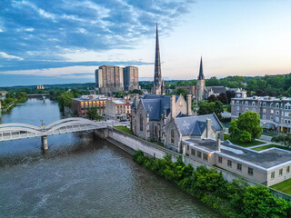 Aerial Birds Eye view of Cambridge Waterloo region Ontario Toronto Canada architecture European style building road street with cars and clouds in the sky