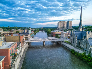 bridge over the river Aerial Birds Eye view of Cambridge Waterloo region Ontario Toronto Canada architecture European style building road street with cars and clouds in the sky