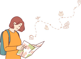 Woman tourist uses paper map to travel through nature reserves and plot route to destination. Smiling girl traveler plans tour route and chooses natural attractions worthy of visiting