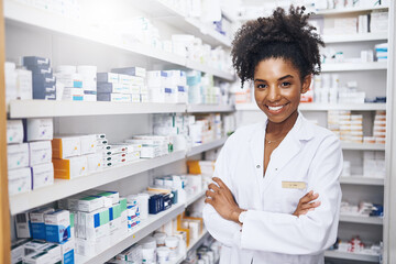 Portrait, pharmacist and confident black woman in clinic for healthcare, medicine and dispensary stock of advice. Smile, female person and medical consultant, pills distribution and pride of health