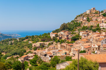 Obraz premium View on the small village of Corbara, located in the northwest of Corsica, a French island in the Mediterranean Sea