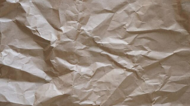 Abstract brown grunge paper background. Old wrinkled creased paper texture background. Stop motion