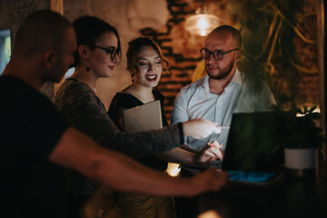 A group of entrepreneurs discussing business strategy and analysis in a modern office setting, demonstrating teamwork and success.