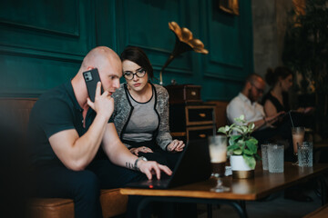 Focused entrepreneurs involved in a business meeting, brainstorming strategy and analysis. Teamwork and collaboration are evident in a professional, modern office setting.