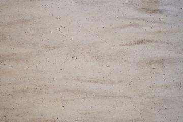 Top view of the texture of a dirty sandy beach as a natural textured background with space to copy. High quality photo