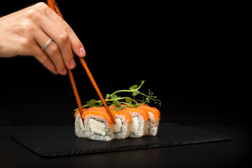 sushi with chopsticks