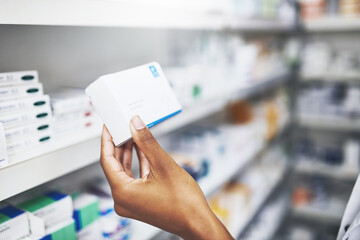 Pharmacist, hands and medicine box in clinic for prescription, information and medical product of wellness. Person, pills and retail shopping, pharmaceutical care and inventory management at pharmacy