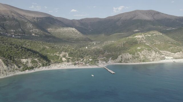 Aerial view of pier by Bunec Beach area in Summer 2022, Albania - raw data