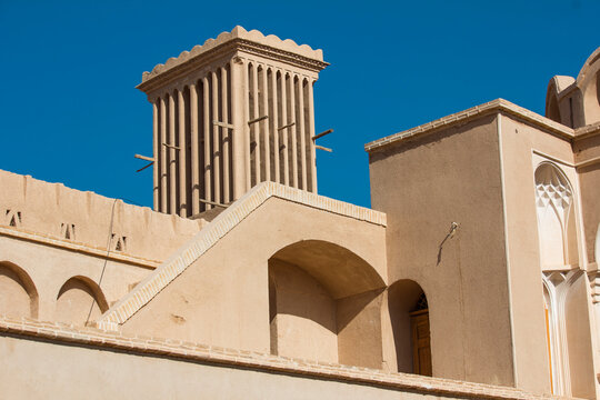  The wind catcher or ventilation tower made with adobes, a genius way to cool down the heat of hot summers with power of nature in the historical mansion of Aghazadeh in Abarkuh, Yazd, Iran.
