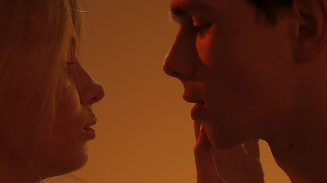 Young man and woman tender lovers faces shot, passion intimacy bode touching, candid feelings, attraction and desire. Love and affection relationships concept.