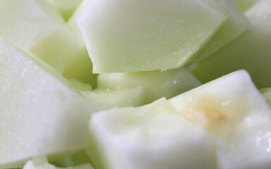 melon background. melon details. melon with selective focus. peeled melon. chopped fruit ready for consumption.