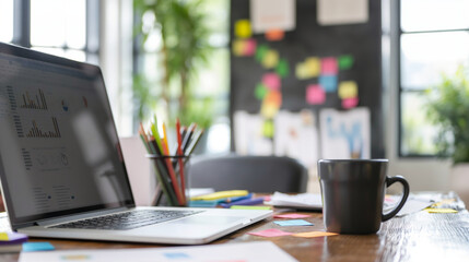 An entrepreneurâs desk with a laptop, coffee mug, and a board filled with sticky notes outlining the business growth plan.