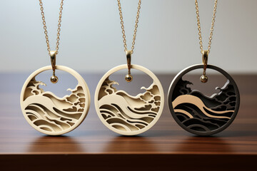 Round pendants with wave and cloud designs.