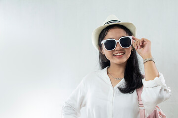 closeup, Young Asian woman wearing straw hat with excited expression and sunglasses running summer vacation, travel advertising studio shoot