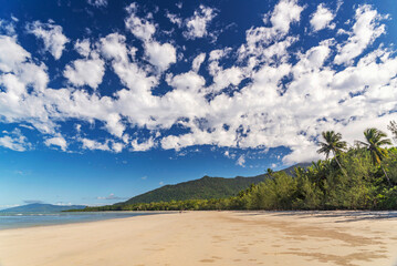 Picturesque tropical coastal sandy beach in Cape Tribulation, Queensland, Australia. Cape Tribulation is within Daintree National Park on Coral Sea.