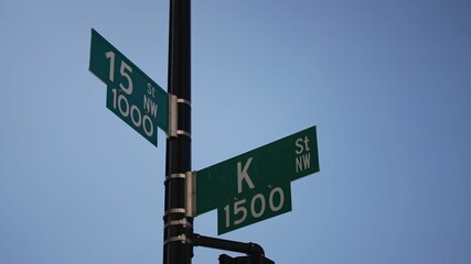 K street nw and 15th street nw street signs in downtown Washington DC symbolizing lobbying and corruption in nations capital