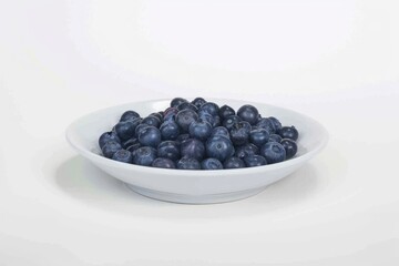 blueberries on a plate , on a white background. close-up.. Beautiful simple AI generated image in 4K, unique.