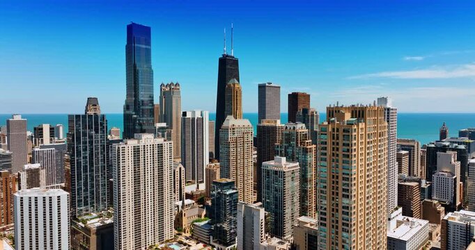 Approaching the Willis Tower and John Hancock Center in the downtown of Chicago, Illinois, the USA. Two highest skyscrapers in metropolis from top.