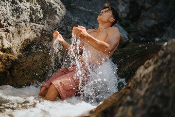 Man cooling off in a refreshing mountain river on a hot day, enjoying the cool water and natural surroundings.