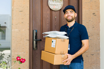 Portrait of a delivery person bringing online shopping orders in boxes and envelopes to a house