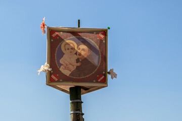 Colorful flag of Saint Anthony on a wooden pole for June festival decoration in Brazil