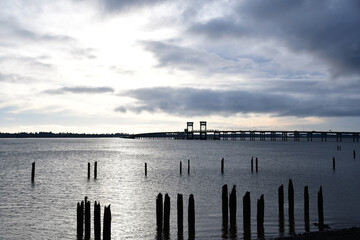 Sunset Over Pilings and Bridge Outside Astoria