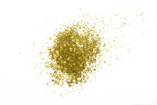Zaatar spice isolated on white. Pile of zaatar (za'atar), a middle eastern spice mix with sesame seeds, salt, oregano, thyme, and marjoram - isolated
