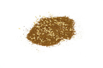 Zaatar spice isolated on white. Pile of zatar (za'atar), a middle eastern spice mix with sesame seeds, salt, oregano, thyme, and marjoram - isolated. herb spice 