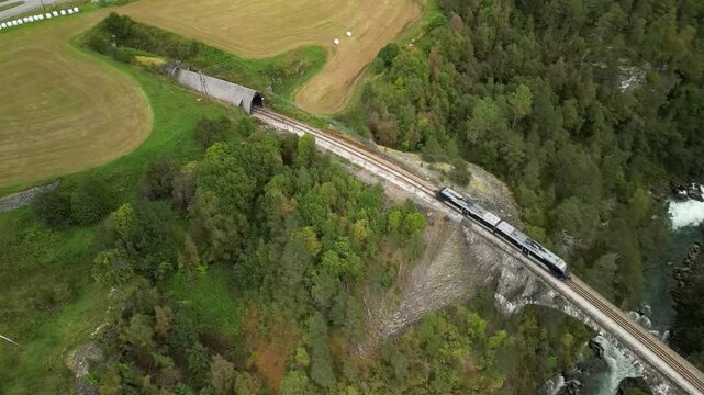 Scenic aerial reveal shot of Kylling railway bridge in Verma, Norway