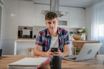 Young caucasian man teenager student study at home