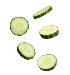 Fresh cucumber slices in air on white background