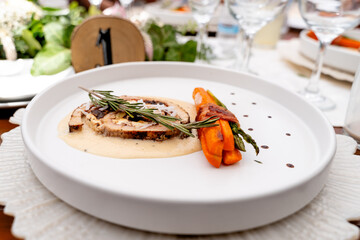 gourmet steak with grilled vegetables and sauce with carrots